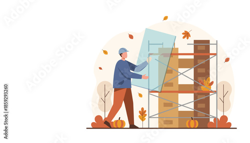 Construction worker installing a glass panel on scaffolding during autumn renovation