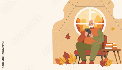 Senior man uses tablet by the window enjoying a relaxing autumn day indoors