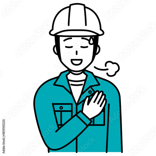 胸に手を当ててホッとする作業員の男性