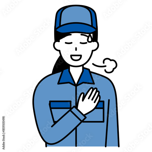 胸に手を当ててホッとするつなぎ作業服の女性