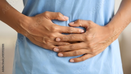 Person Holding Stomach - Abdominal Pain or Pregnancy