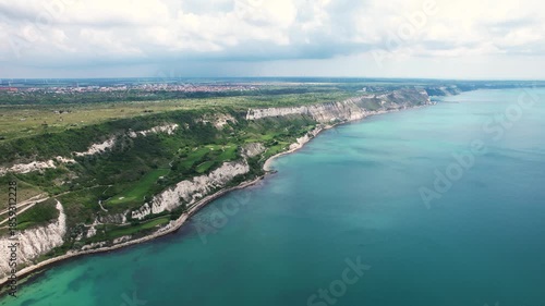 Wallpaper Mural Aerial view of the rugged coastline meeting the turquoise sea, where striking white cliffs contrast with the lush greenery above, Bozhurets, Kavarna, Bulgaria. Torontodigital.ca