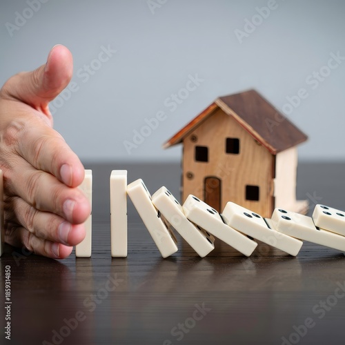 Domino Effect - Hand Stopping Collapse of Wooden House Domino Chain
