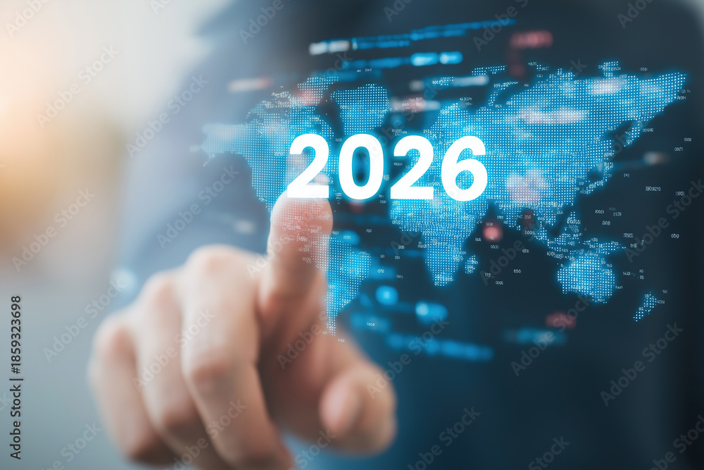 Fototapeta premium Finger activates holographic 2026 above global map and data visualization screens.