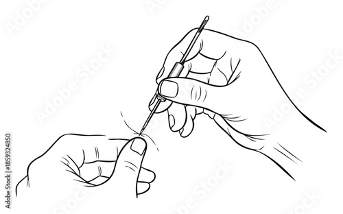 Close up view of hands using a handy needle threader to efficiently put thread through the eye of a sewing needle for a quick fix or handicraft project.