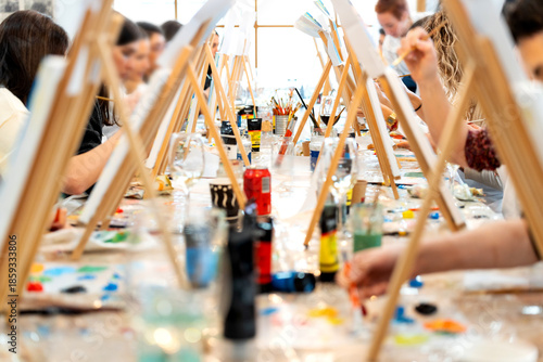 Women enjoying sip and paint art class workshop