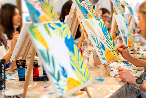 Women enjoying sip and paint art workshop