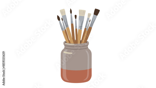 Glass jar filled with a collection of various paint brushes, representing art, creativity, hobbies, and artistic tools.