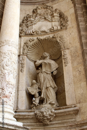 Statues of saints at Valencia Cathedral, highlighting historic religious sculpture and Gothic stone architecture, taken in July 2024.