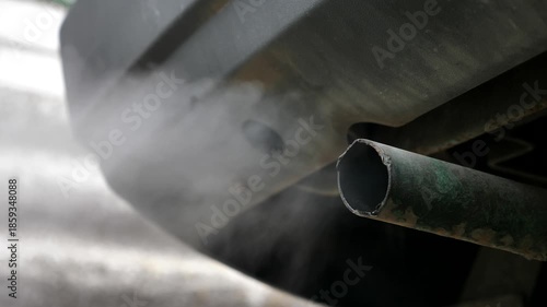 Car exhaust. Environmental issues. Smoke from a car tailpipe.
