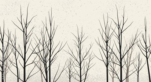 Silhouette of bare tree branches against a textured pale background creating a minimalist winter forest landscape.