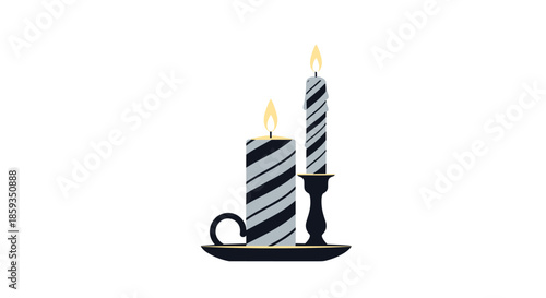 Set of two decorative striped candles with burning flames standing on a black plate with a gold rim for home decor.