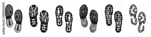 Black shoe footprint silhouettes with different sole tread patterns. High contrast tracks for outdoor and crime scene concepts