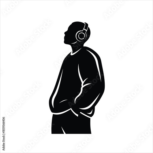 Silhouette of man wearing headphones looking to side profile