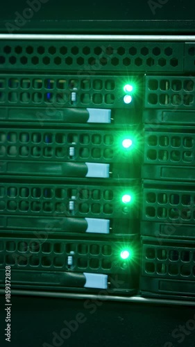 Server rack blinking green lights in data center. Media