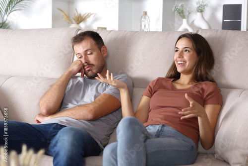 Bored man listening to talk his partner or friend
