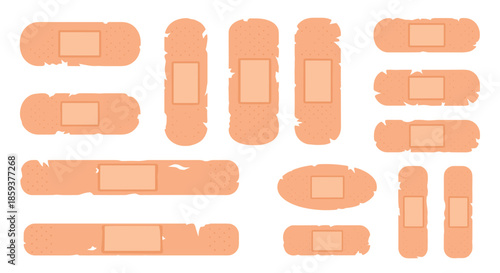 Collection of various shapes and sizes of skin colored adhesive bandages and medical plasters for first aid and wound care.