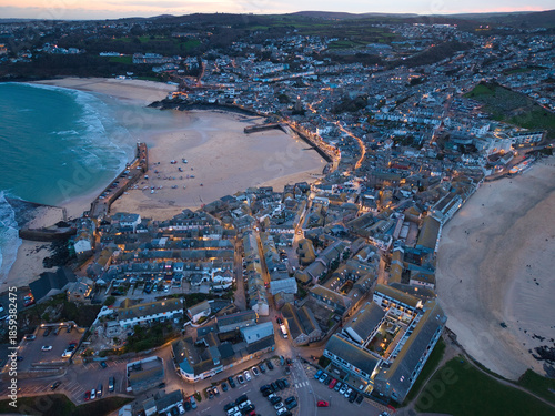 Vibrant twilight elevated capture of St Ives town, bay and beaches in Cornwall, UK