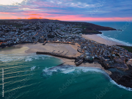 Vibrant twilight elevated capture of St Ives town, bay and beaches in Cornwall, UK