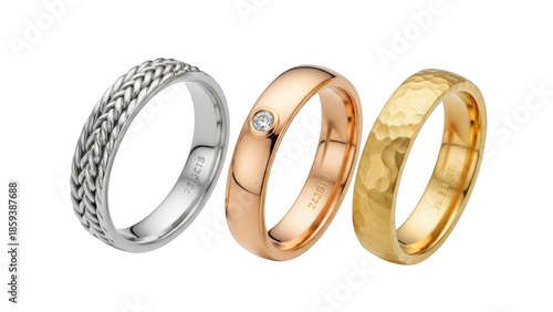 Three wedding rings in different metals and textures on black background jewelry gold