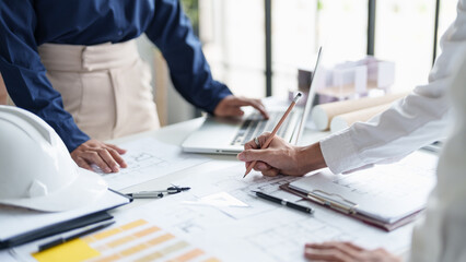Architecture drawing on architectural project business architecture building construction Colleagues designer Planning Design on blueprint and compasses