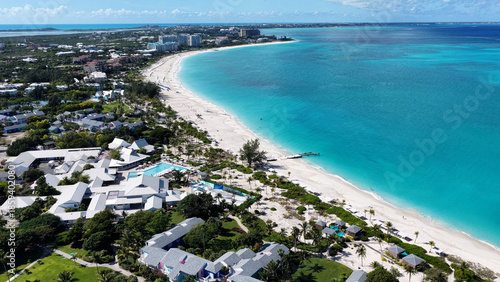 Grace Bay Beach At Providenciales In Overseas Territory Turks And Caicos Islands. Caribbean Beach. Tropical Scenery. Stunning Highrise Buildings. Grace Bay Beach In Turks And Caicos Islands. 