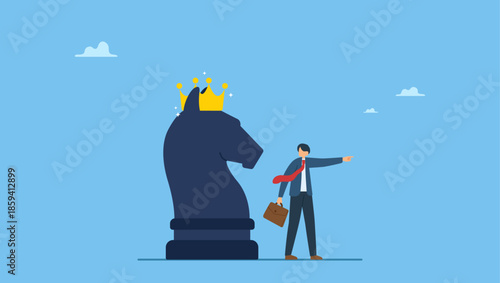 Smart businessman pointing finger to direct chess knight with king crown. Strategy to win business competition, leadership to make decision, business challenge or tactic to overcome obstacle.