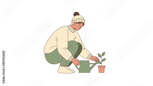 Young woman in cozy clothing watering a potted plant outdoors with a watering can during daytime