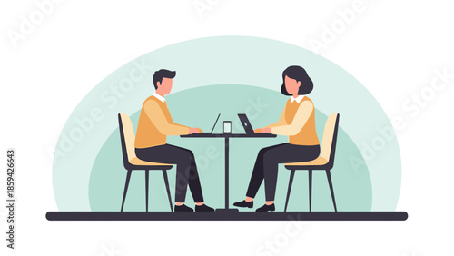 business meeting between two colleagues sitting across each other using laptops in a modern office
