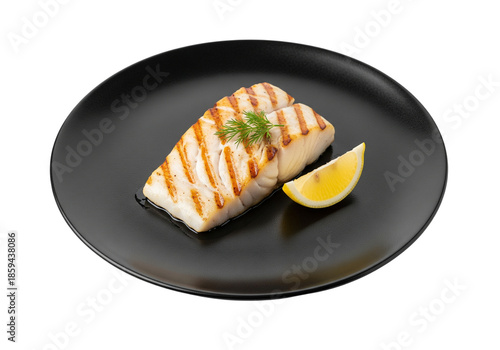 Grilled Cod Fillet on Black Plate with Lemon Wedge