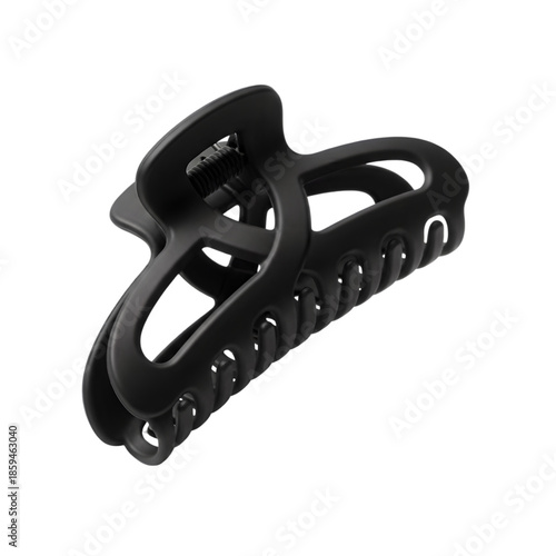 Modern black hair claw clip isolated on a black background studio shot