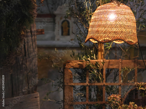 Old vintage wooden furniture and wicker lamp in old house. Rustic style. Background for design. 