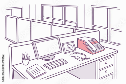 A modern office cubicle with a computer and telephone on the desk