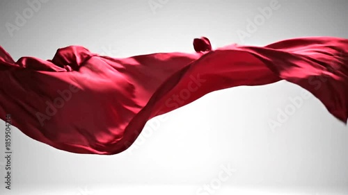 Red Fabric Flowing and Dancing in Slow Motion Against a White Background.