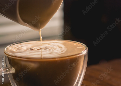 Foto Pouring Creamer into Morning Coffee