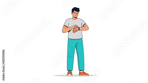 Young man checking smartwatch on his wrist while standing casually in casual attire