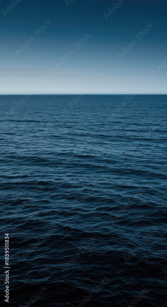Fototapeta premium A vast expanse of dark blue oceanic water showing gentle waves reflecting the bright sky. The deep, rich color suggests purity and endless natural power ,ripple ,global ,aqua