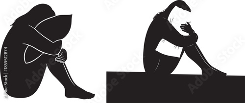 Two sad people sitting alone in dark silhouette