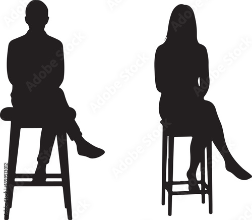 Silhouettes of man and woman sitting on stools in relaxed poses