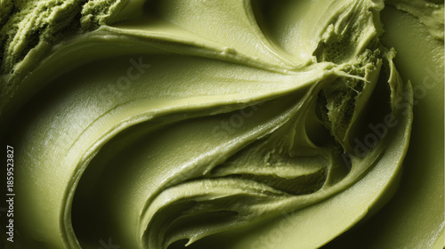 Pistachio gelato green ice cream creamy texture frozen dessert closeup swirl dairy food sweet treat summer snack gourmet scoop cold refreshment