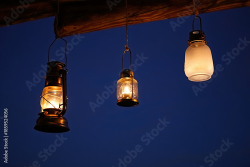 Hanging light bulb and old fashioned lantern on the wall