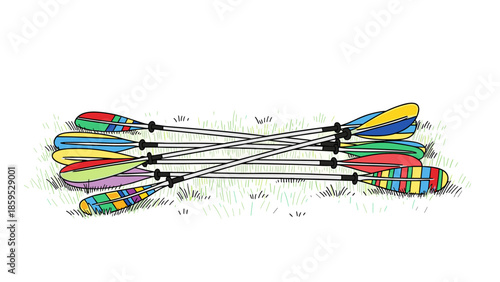 Colorful canoe paddles on grass with geometric designs