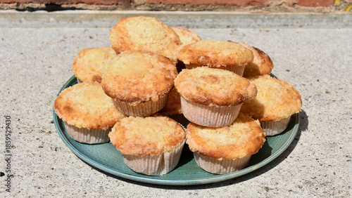 Plate of Lemon Streusel Muffins on Rustic Concrete Countertop