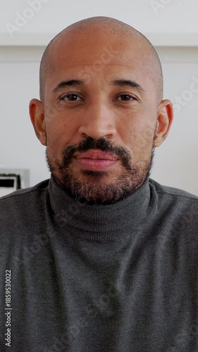 Vertical HD video. Close up POV man listening colleague on laptop video call working from the office. Young entrepreneur male talking with partner through online meeting. Business people concept