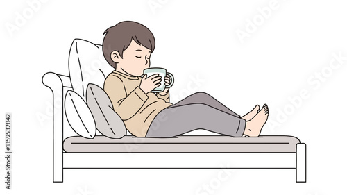 A young boy is relaxing on a couch, holding a mug and drinking from it with his eyes closed.