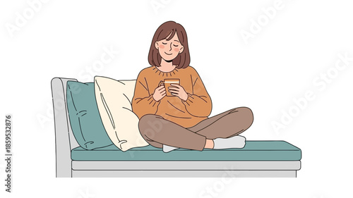 A relaxed young woman sits cross-legged on a comfortable couch, holding a mug and smiling with closed eyes.