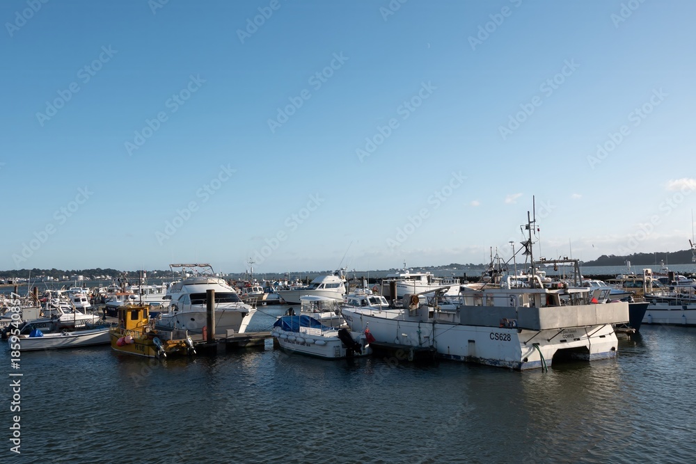 Fototapeta premium Poole England - December 25 2025: boats in the harbour in Poole Quay Dorset England