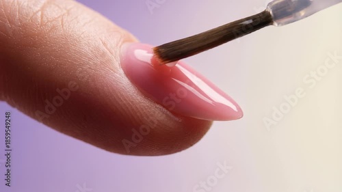 Wallpaper Mural woman is meticulously applying pink nail polish to her manicured finger, within purple and yellow gradient home setting, tranquility, beauty, care, wellness, nail care., Holiday season Torontodigital.ca