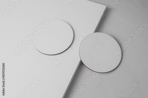 White round coasters on a light background