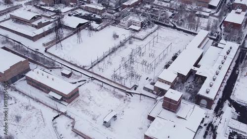 Aerial view of a power substation at an aluminium factory during winter